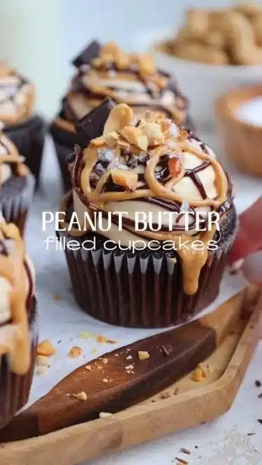 Peanut butter-filled chocolate cupcakes topped with chocolate frosting