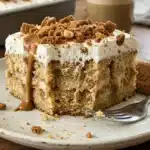 Ultimate Biscoff Poke Cake with rich frosting and cookie toppings