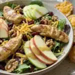 Apple grilled chicken salad with cheddar toasts served on a plate